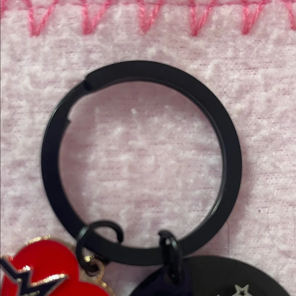 Source Unknown keychain red